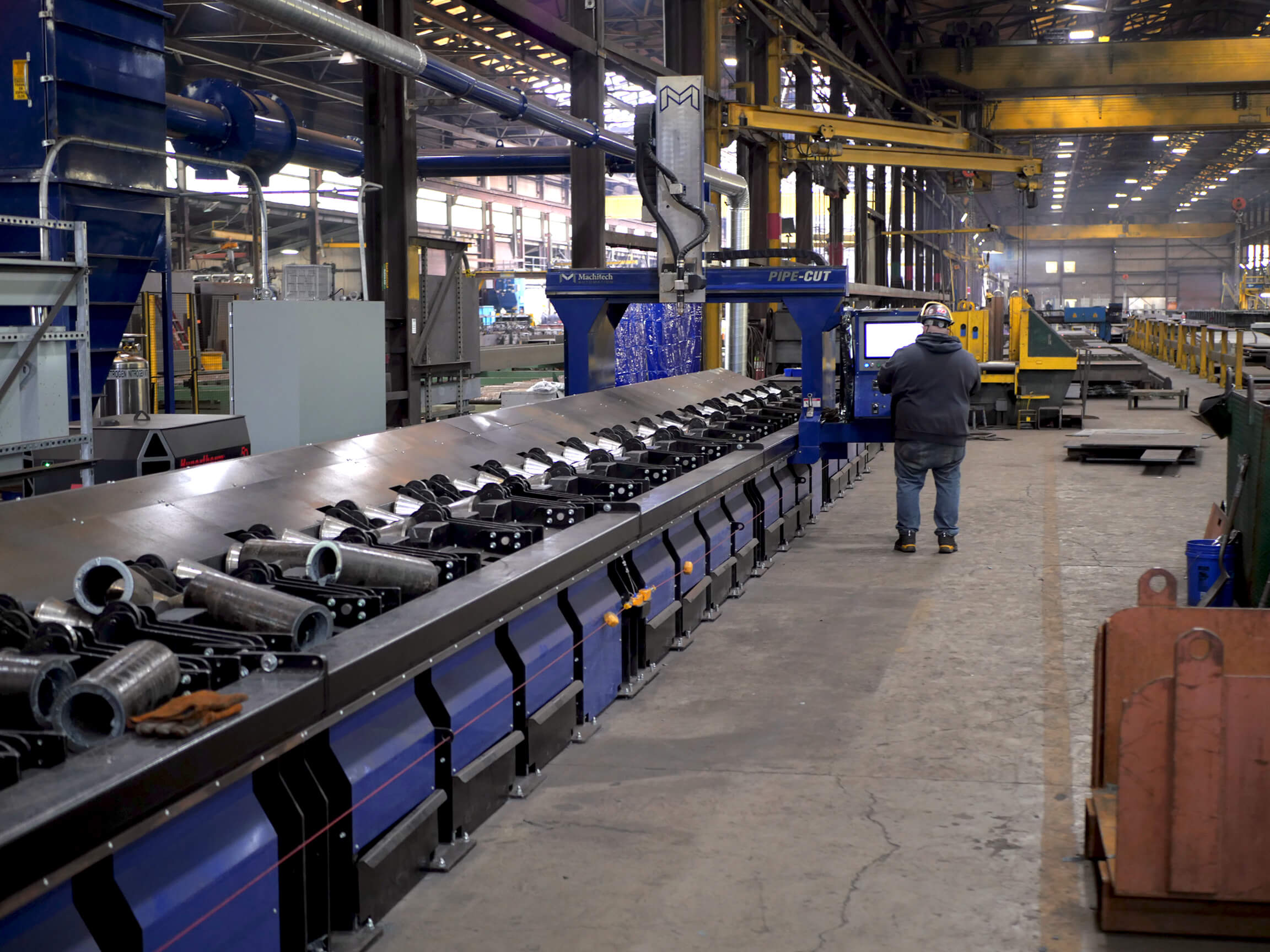 A Machitech CNC Plasma Pipe Cutter in a shop